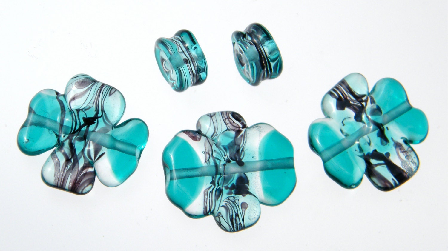 Lampwork sculpted bead set in teal, clear, and black