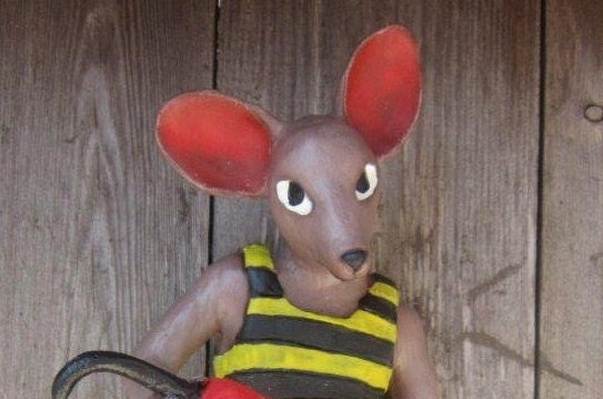 Carnival mouse with red umbrella.
