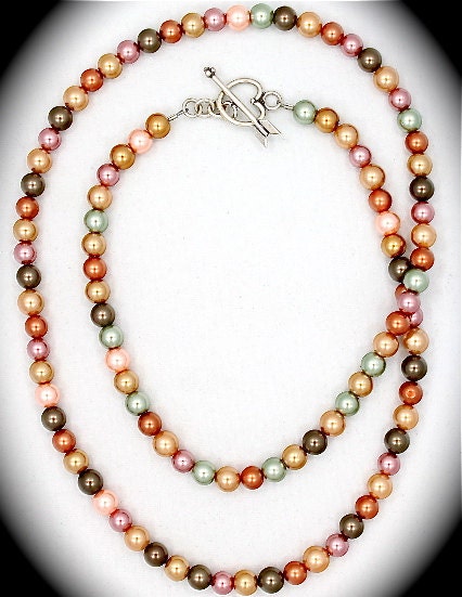 Long multi-colored pearl necklace with lovely sterling heart toggle.