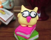 Smarty the nerdy owl figurine.