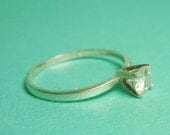 The "Other Kelly" A 5mm Moissanite Solitaire Sterling Silver Open V Prong Ring