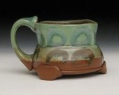 Mug with green tone variations and subtle circles