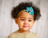 Blue flower with gem on an elastic headband perfect for everyday wear