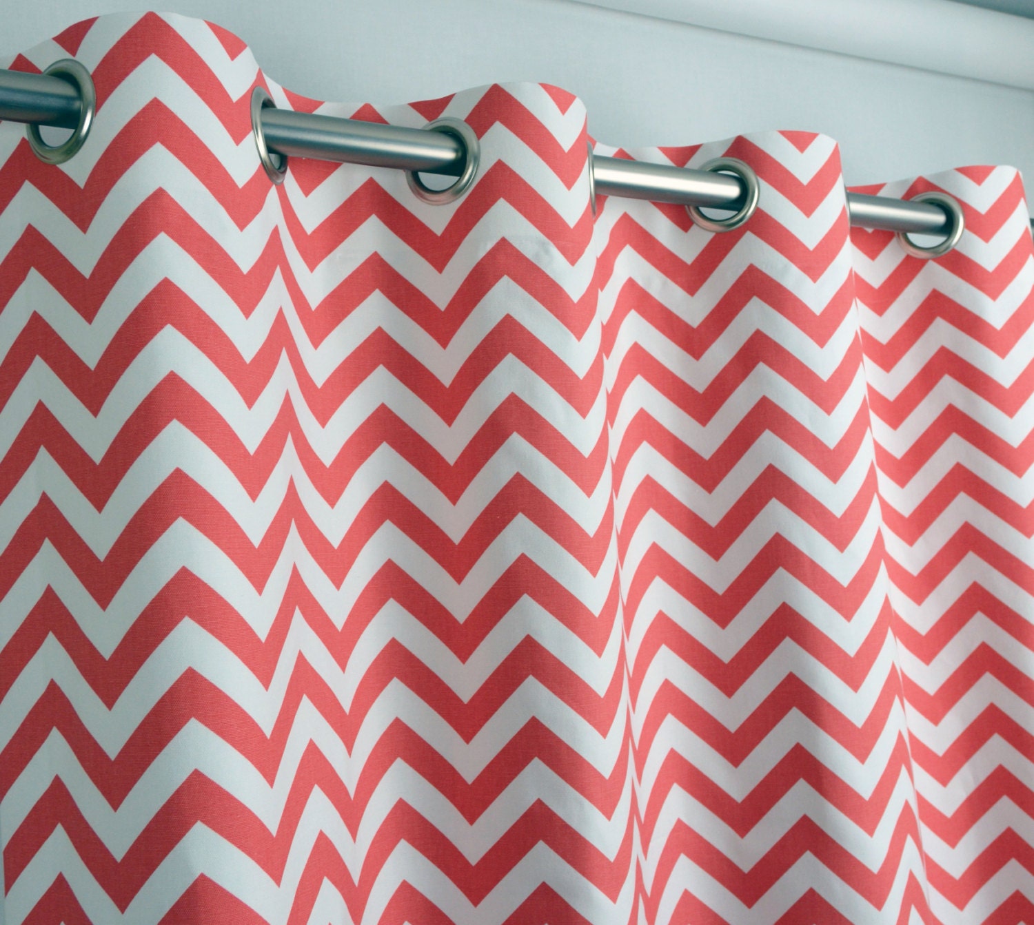 Pair of Grommet Top Curtains in Mandarin Coral and White Chevron Zig Zag Print
