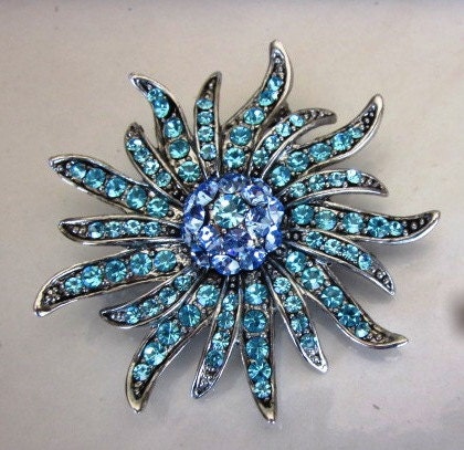 Vintage Blue and Purple Rhinestone Starburst Brooch in Silver Setting