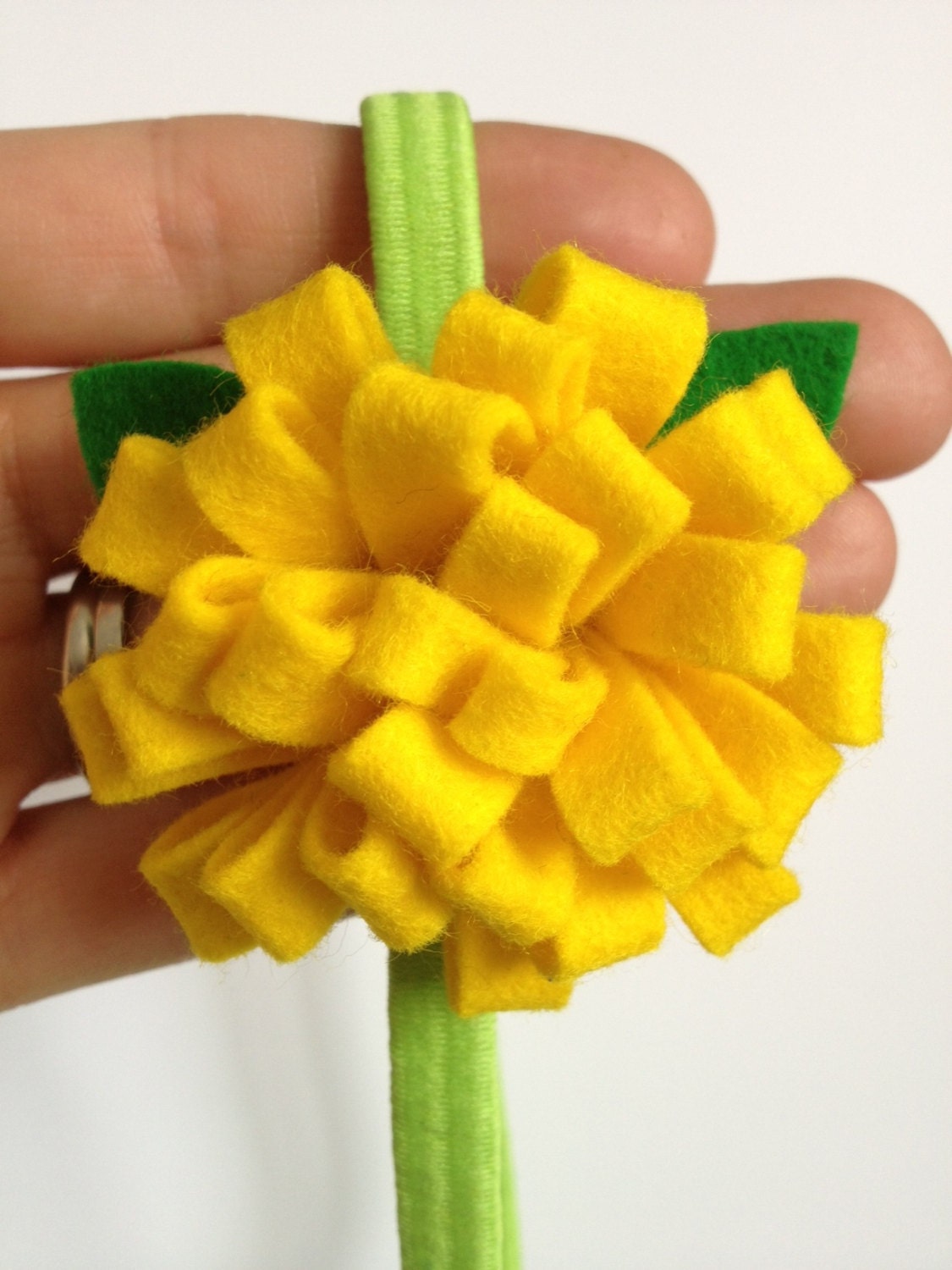 100% Wool Felt Lemon Yellow Mum Flower Headband with Green Leaves on a green headband