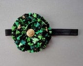 St. Patrick's Day green and black clover shamrock printed ruffle flower with gold button on black elastic headband
