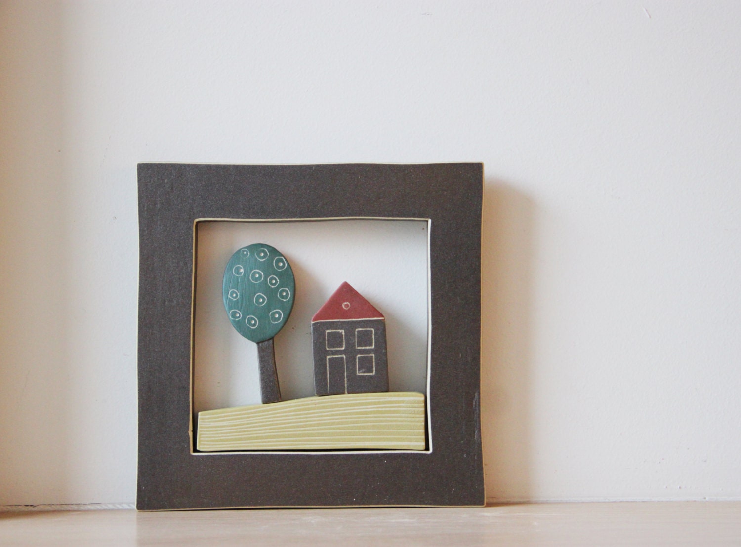 Ceramic Greek cottage with tree, stoneware wall hanging of a house and tree in  a square frame
