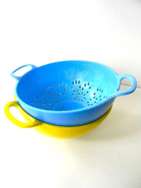 two vintage mini colander strainers in blue and sunny yellow