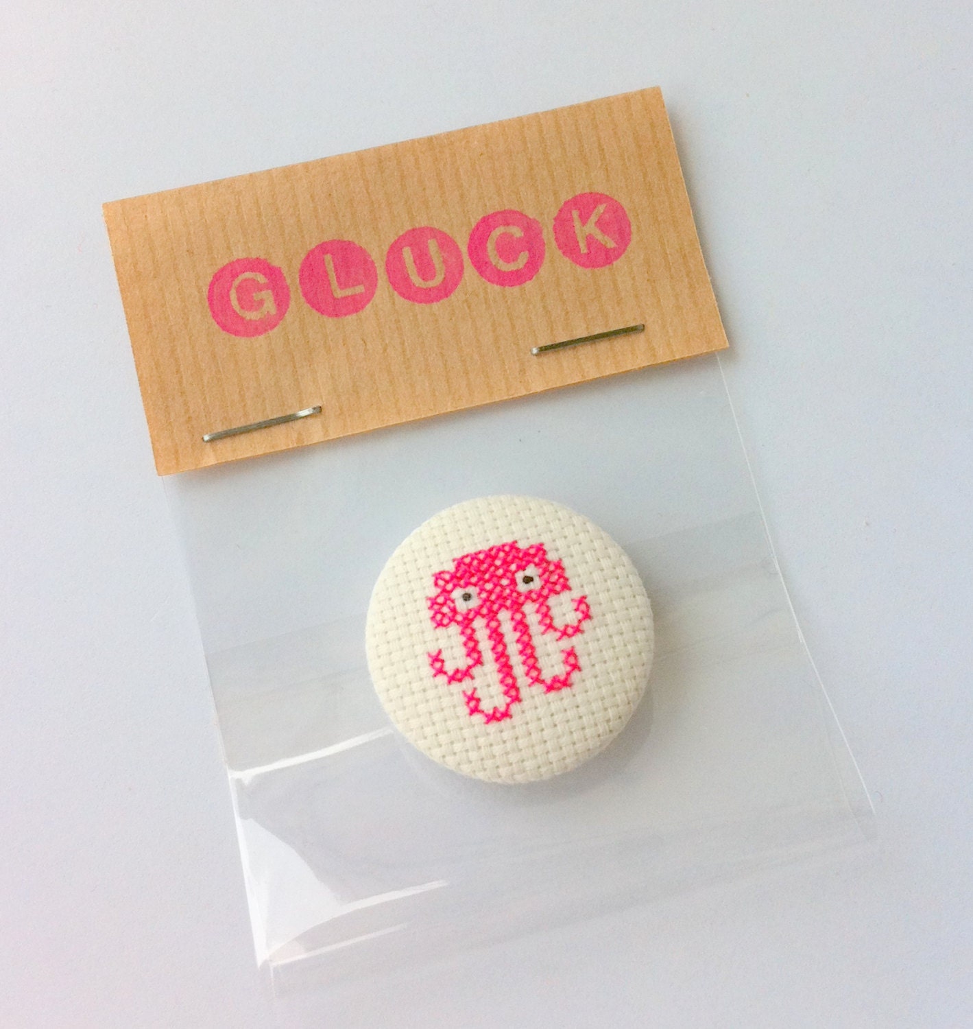 Modern embroidered pinback button - pink jellyfish