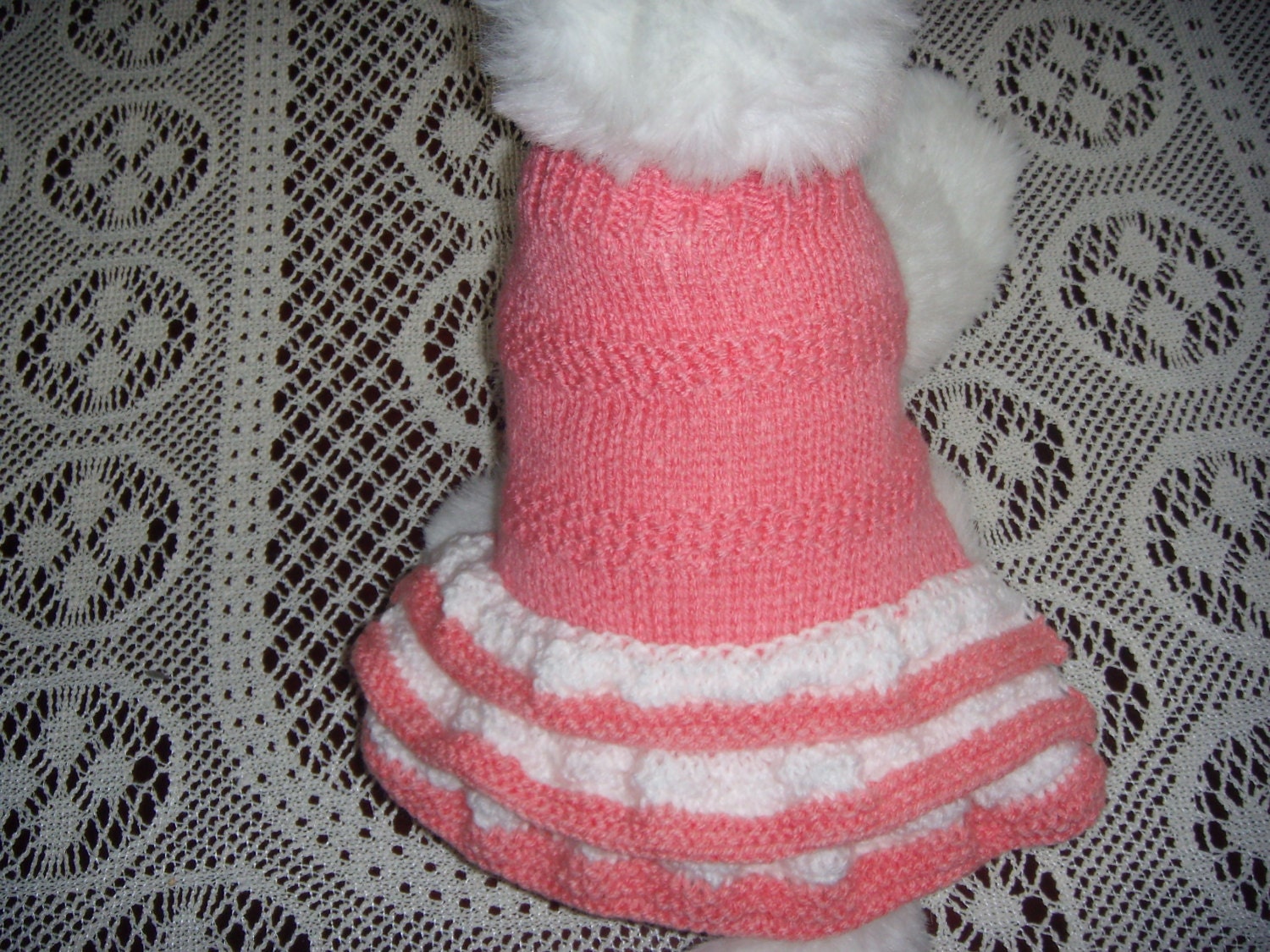 Dog clothes, dog sweater, dog dress, in beautiful peach with a white and peach trimmed frills.