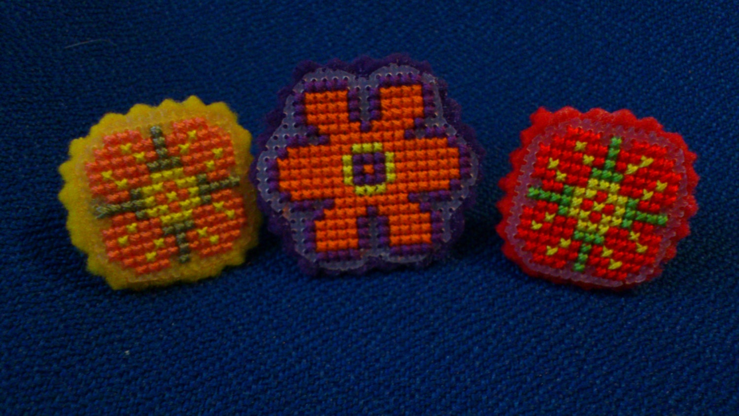 flower rings, choice of 3, cross stitched with fleece back, adjustable silver tone band