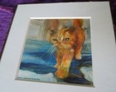 Original watercolor of an orange cat matted and framed in a thin metal frame.  Artwork 8"x8"