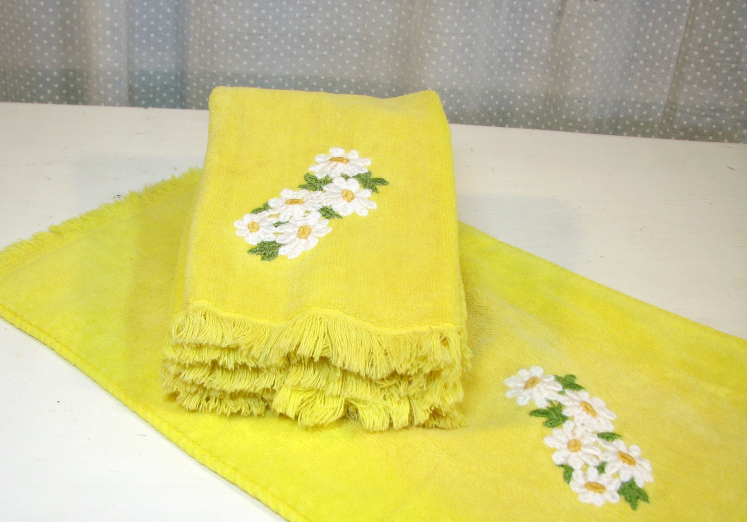 Four Yellow Fringed Hand Towels with Daisy Applique