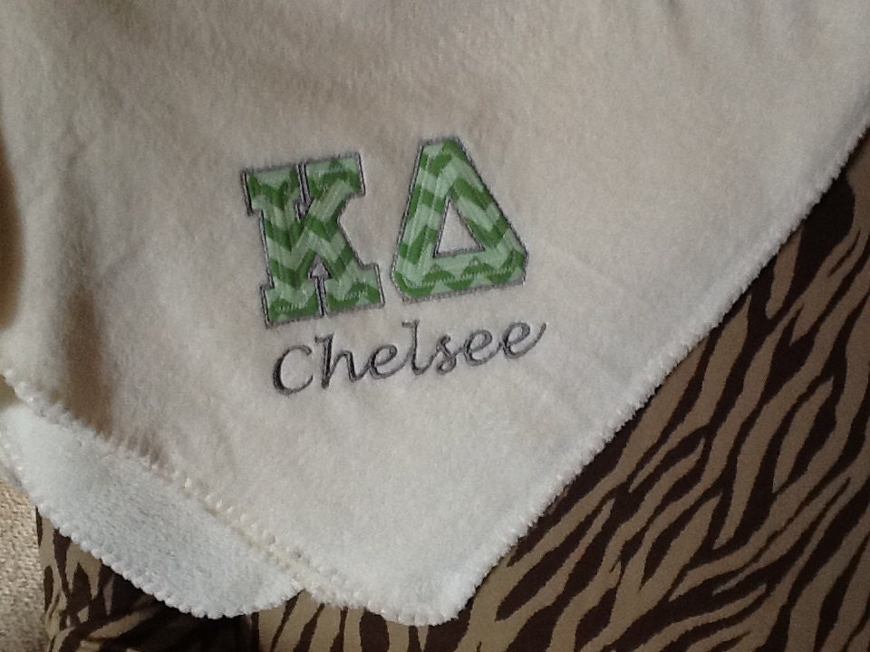 Throw with custom appliqué and embroidery.
