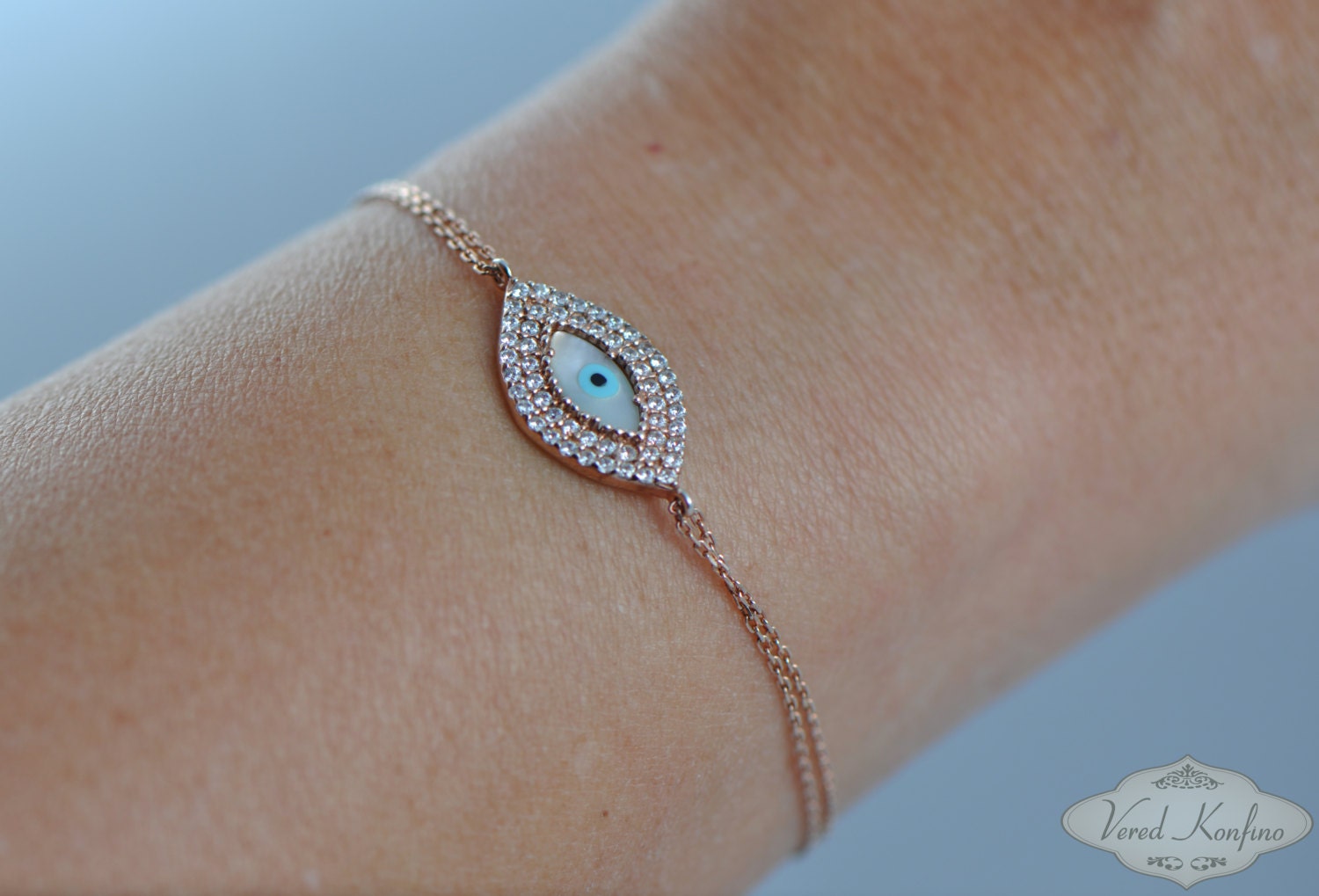 Evil eye chine bracelet plated 14k rose gold studded with Zircons.