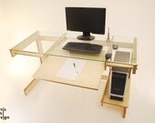Computer Desk: Lazor cut hand finished birch plywood desk with glass top