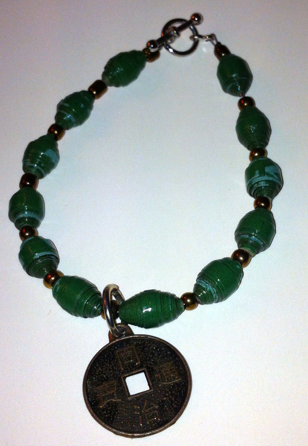 Dianes Paper Beads-Dark Jade Green Paper Bead Bracelet with a Asian Coin Charm. This would be a Great Jewelry Gift or  for any Occasion.