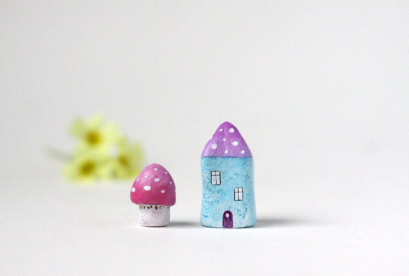 Little light blue clay house with lavender roof and polka dots and a tiny pink toadstool mushroom