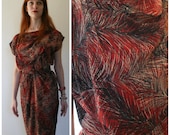 80s does retro day dress, brushed tropical leaf abstract textile, draped bias bodice with matching fabric belt.