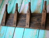 Industrial chic Coat Rack created with wooden insulator posts