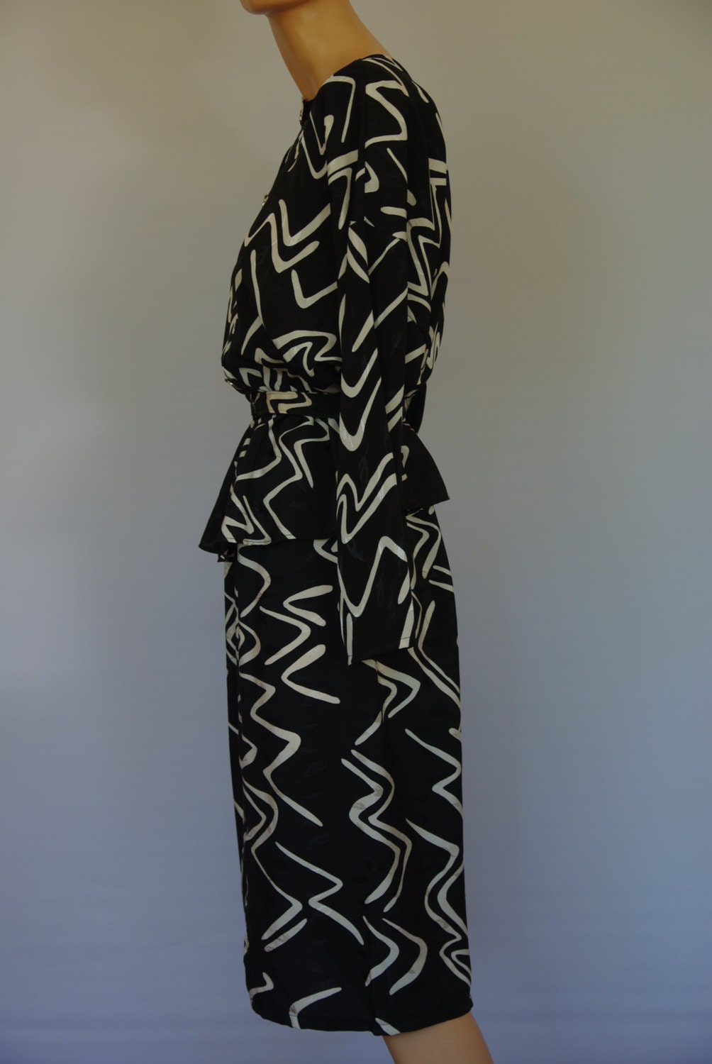 Stunning black and white 1980s peplum cocktail dress