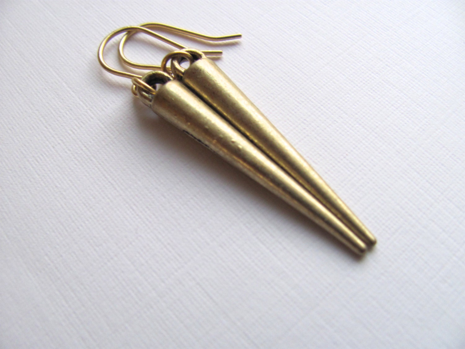Minimalist gold tribal cone spike earrings on 14k gold plate fixtures