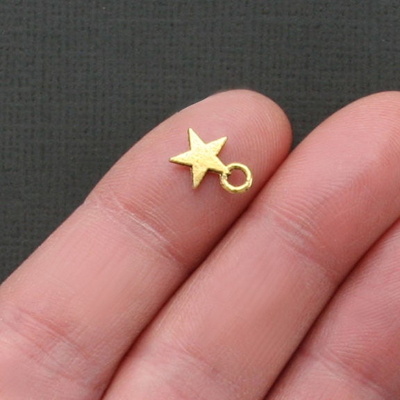 16 Star Charms Antique Tibetan Gold Tone Tiny Size - GC046