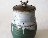 Utilitarian green and white jar