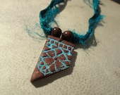 Alina. Lace Textured Polymer Clay Pendant on Recycled Sari Silk Ribbon. Turquoise, Brown. Wooden Beads.