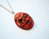 Polymer clay zombie face pendant