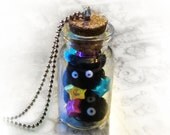 Soot sprites in a bottle necklace