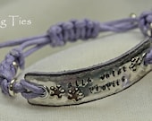 Alis volat propiis leather and aluminium bracelet with knotwork, quote stamp plus butterfly and crystal detailing