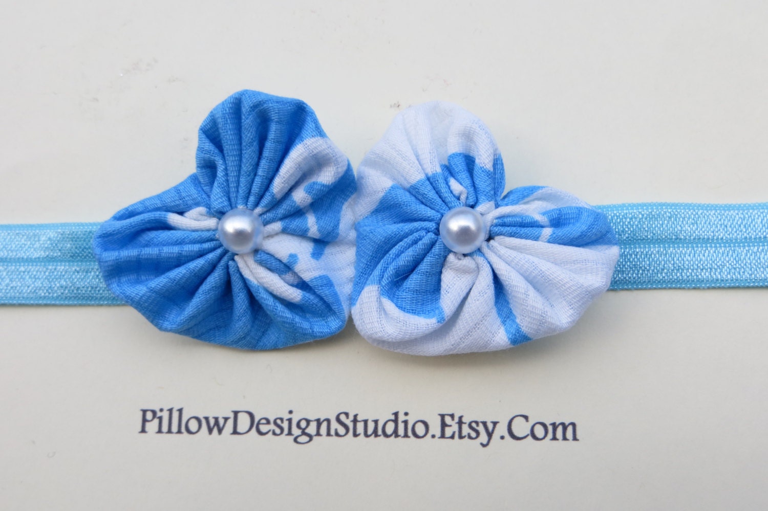 North Carolina Tar Heel baby headband -- blue heart headband with pearl buttons on white or light blue elastic University of North Carolina
