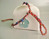 Red, white and blue slave anklet. Tan deerskin and hemp cords. Hand braided. Foot jewelry.
