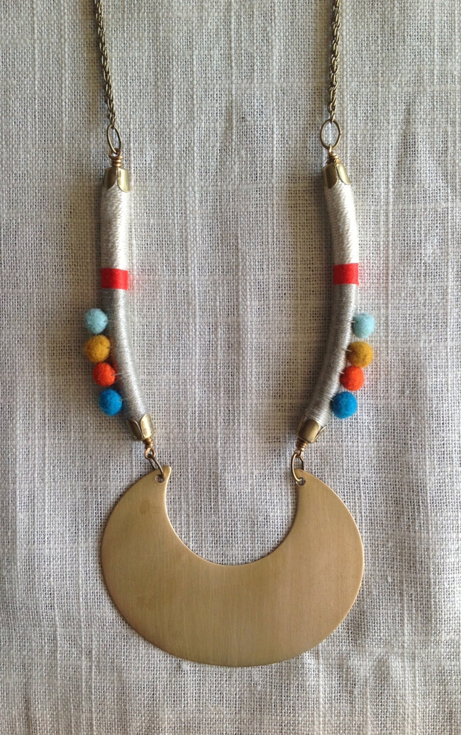 MARISA Necklace Color Study No. 33--Bold Statement Necklace with a Large Brass Crescent, Hand Felted Wool Pom Poms, Color Wrapped Leather