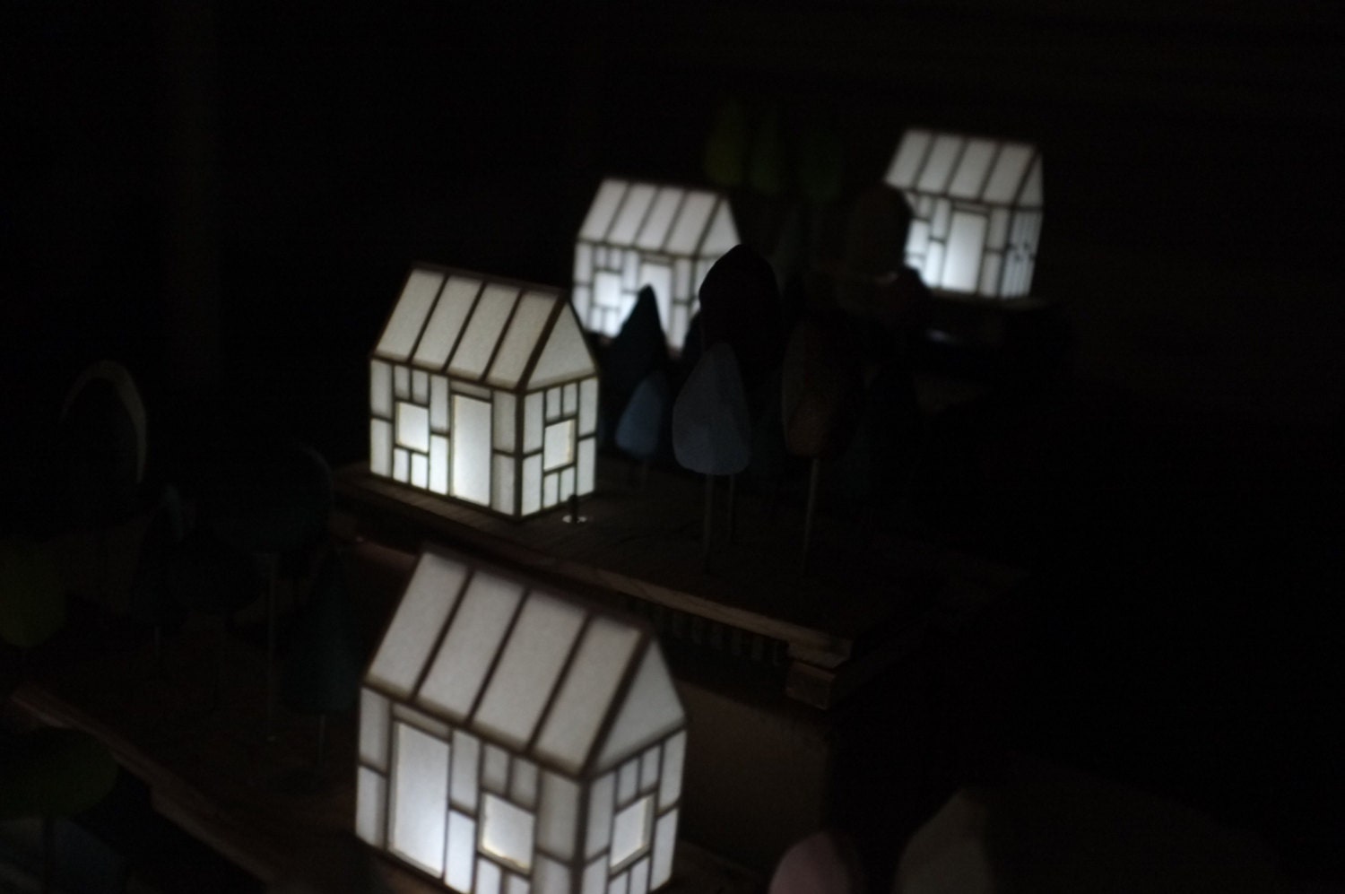 Miniature house light with subtle pastel trees on a antique Victorian wood base
