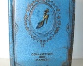 Blue resin book sculpture with brass women's shoe, sun catcher, unique, by Leslie Fry