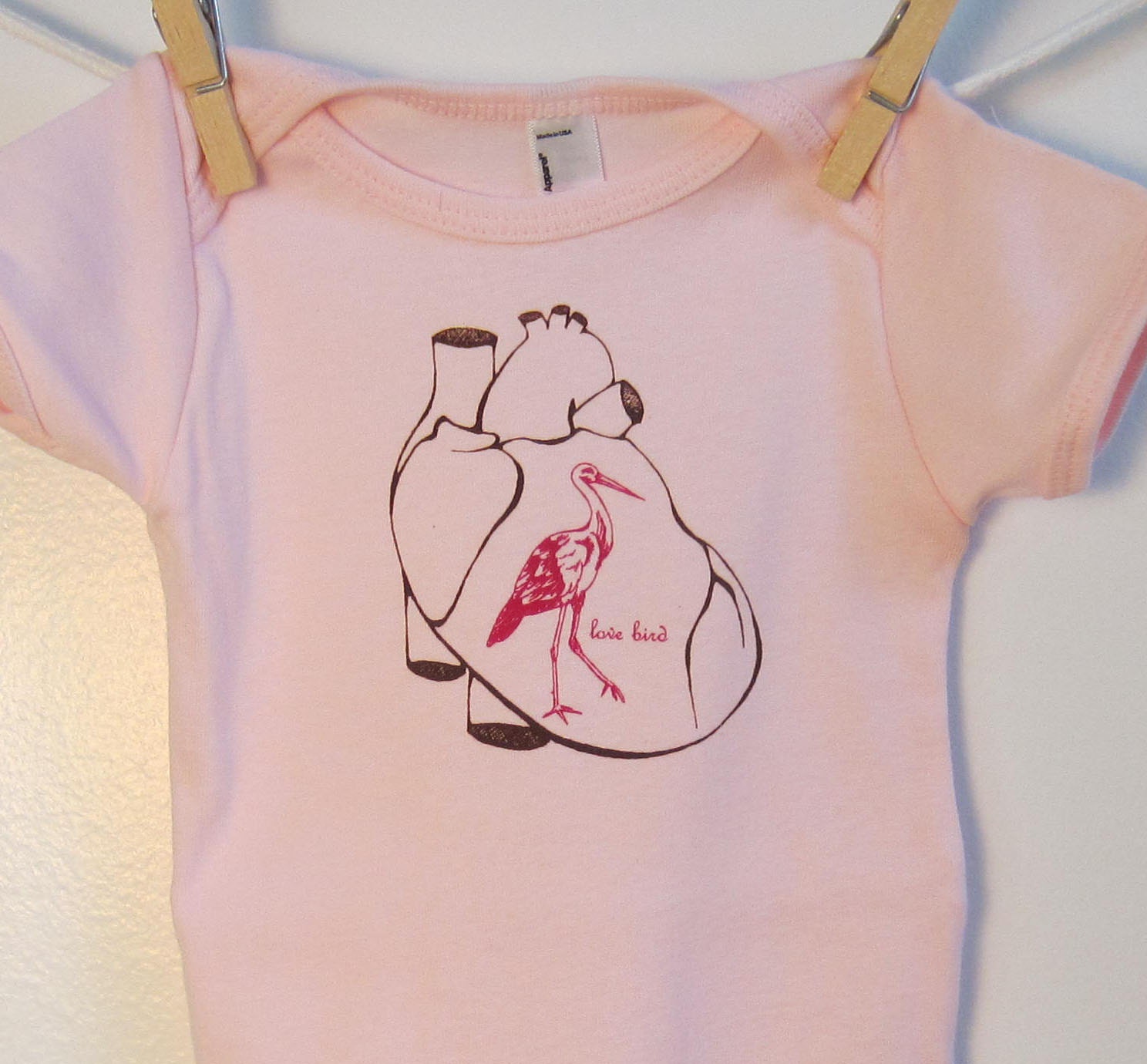 Pink Baby Onesie featuring Love Bird with Anatomical Heart