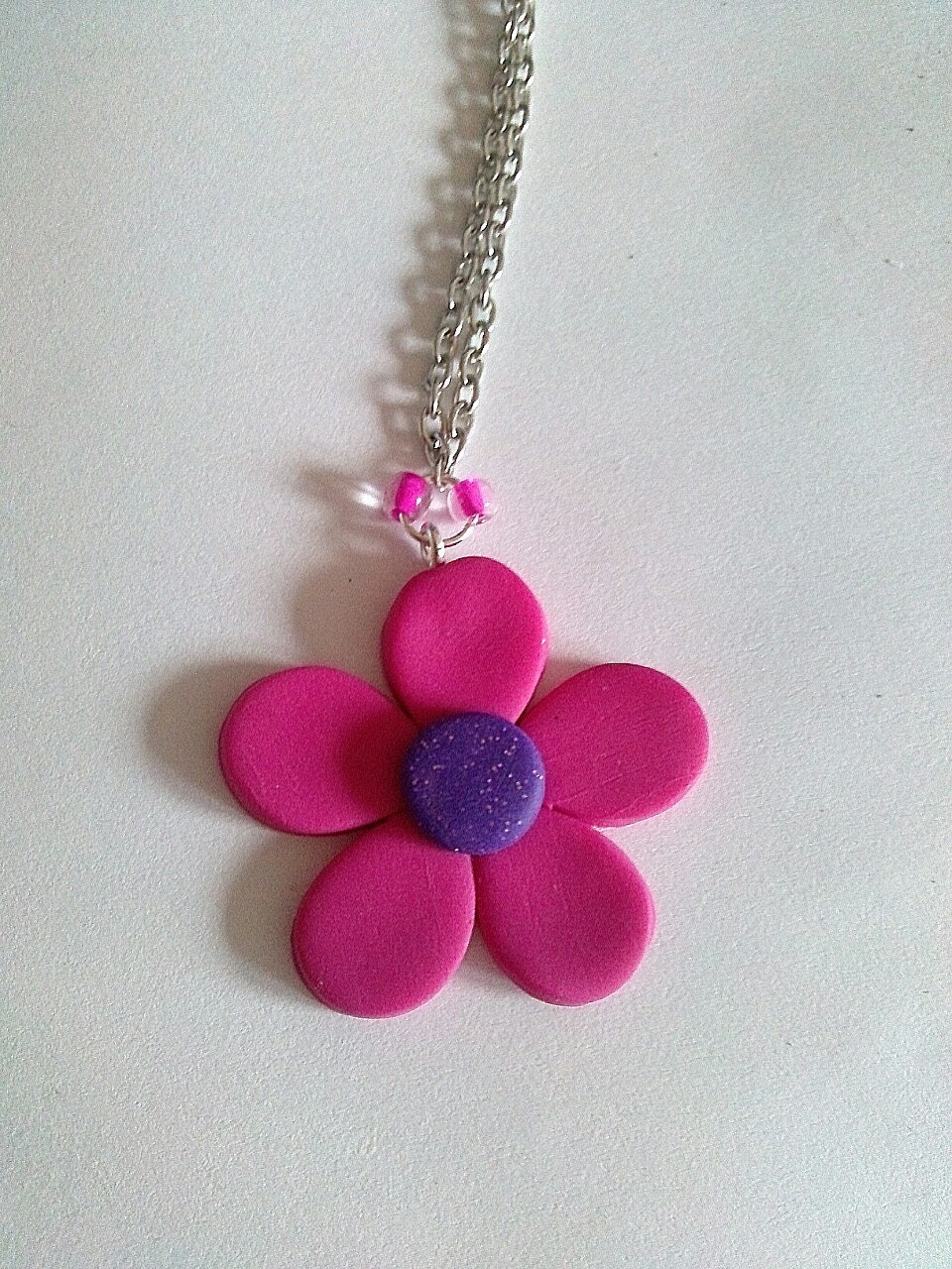 Pink and glittered purple polymer clay flower necklace with silver chain