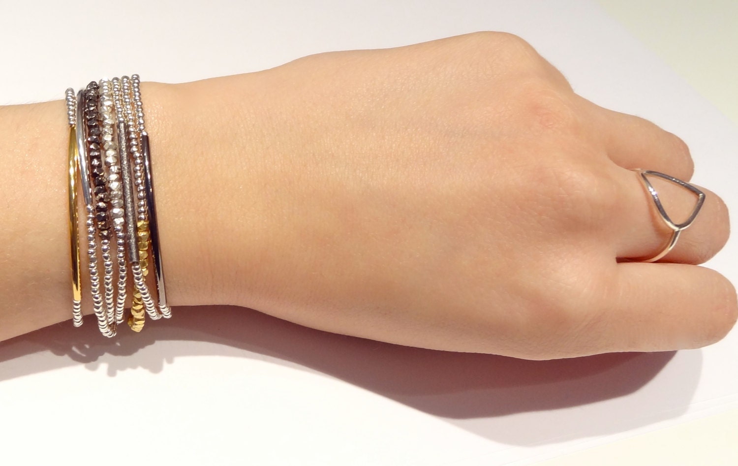 metalic heartlines in silver & gunmetal // dainty bracelet with mini geometric nugget gunmetal plated beads and shiny silver seed beads