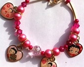 Betty Boop collectable heart charm bracelet in pink pearls