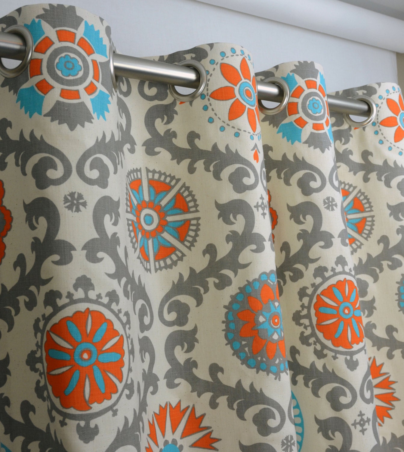 Pair of Grommet Top Curtains in Mandarin Orange and Natural Rosa Print Dossett