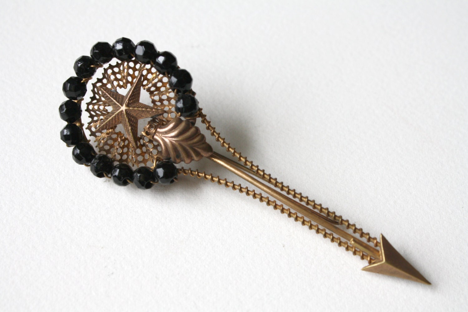 Star and Arrow Brooch with Black Glass Beads