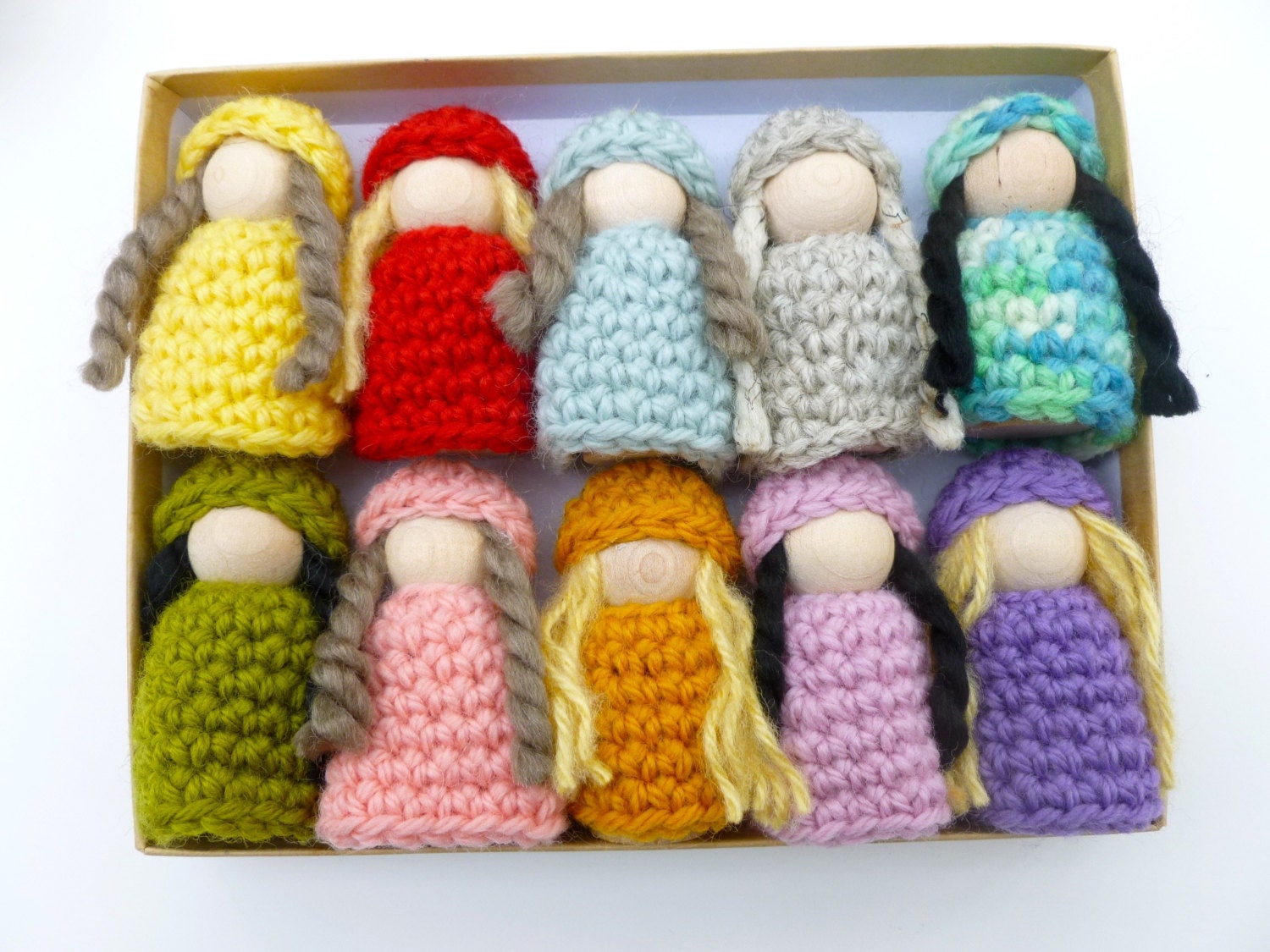 10 wood peg dolls dressed in wool dresses