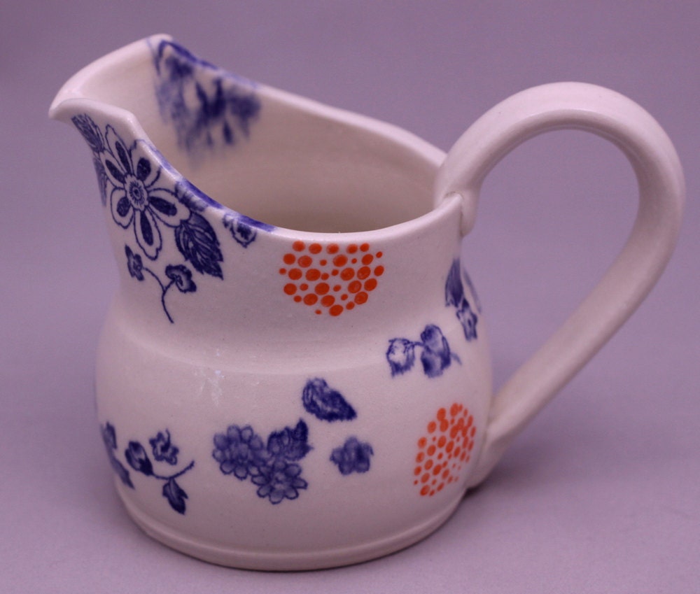 floral blue flame orange dots white serving pitcher