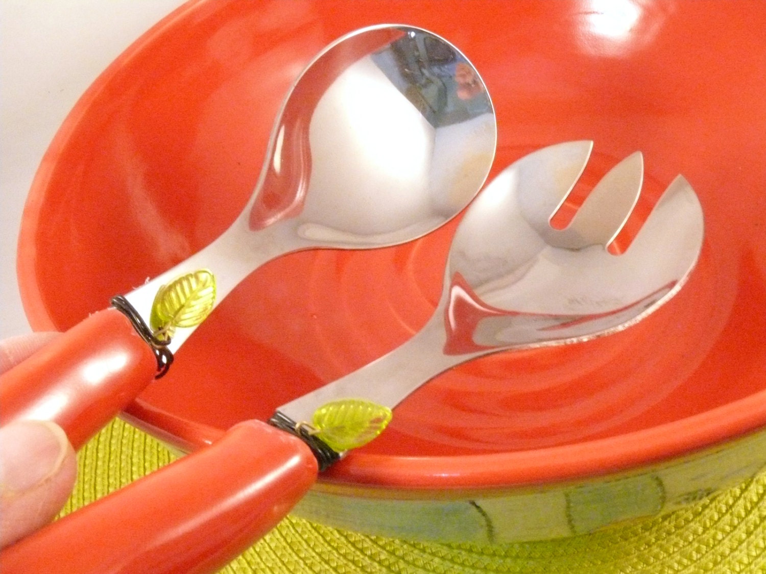Red salad tongs serving fork and spoon for salad or pasta