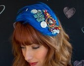 Teal blue feather and brooch hat
