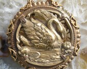 Serene swan pendant in vintage brass and brass filigree..