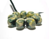 Handmade Lampwork Glass Beads in Raku and Opal Yellow on Black set of 9 - Raku Splash with Opal Yellow Chunky Ovals